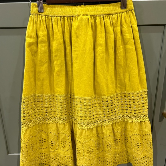 Greenish yellow skirt with elastic waist and wooden button detail. Size Small. - Picture 3 of 3